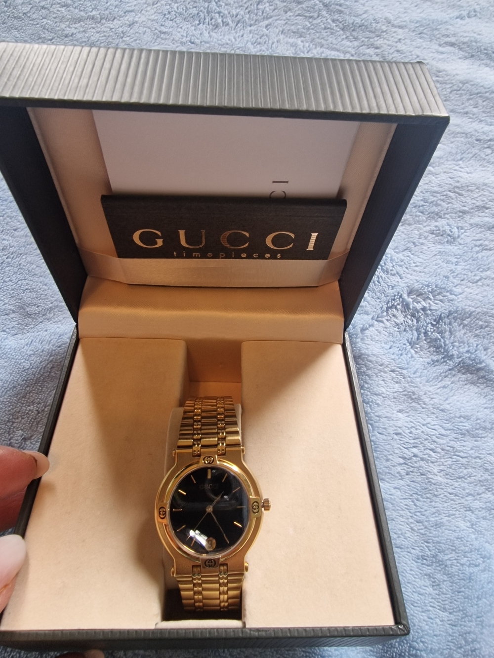 Gucci Gold Tone Watch with Black Dial